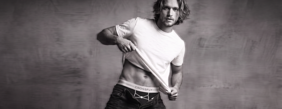 Crossfly underwear black and white banner. Male model wearing the IKON black silver boxers