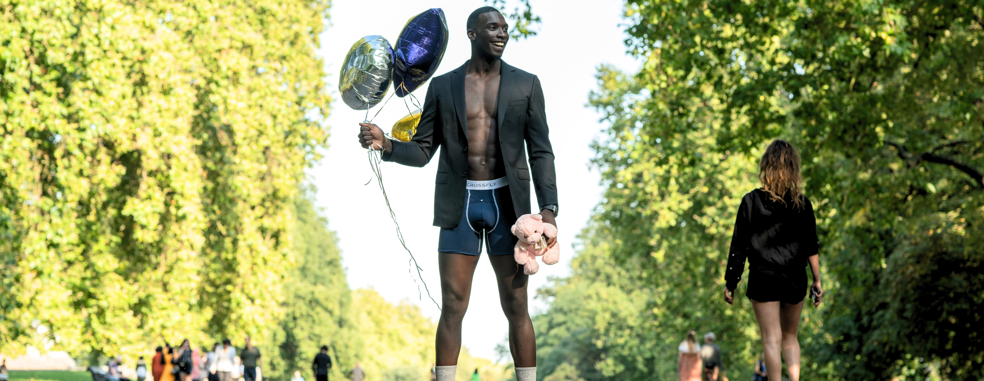 Model in Crossfly Men's underwear, ikon 6" boxers, smiling in London park