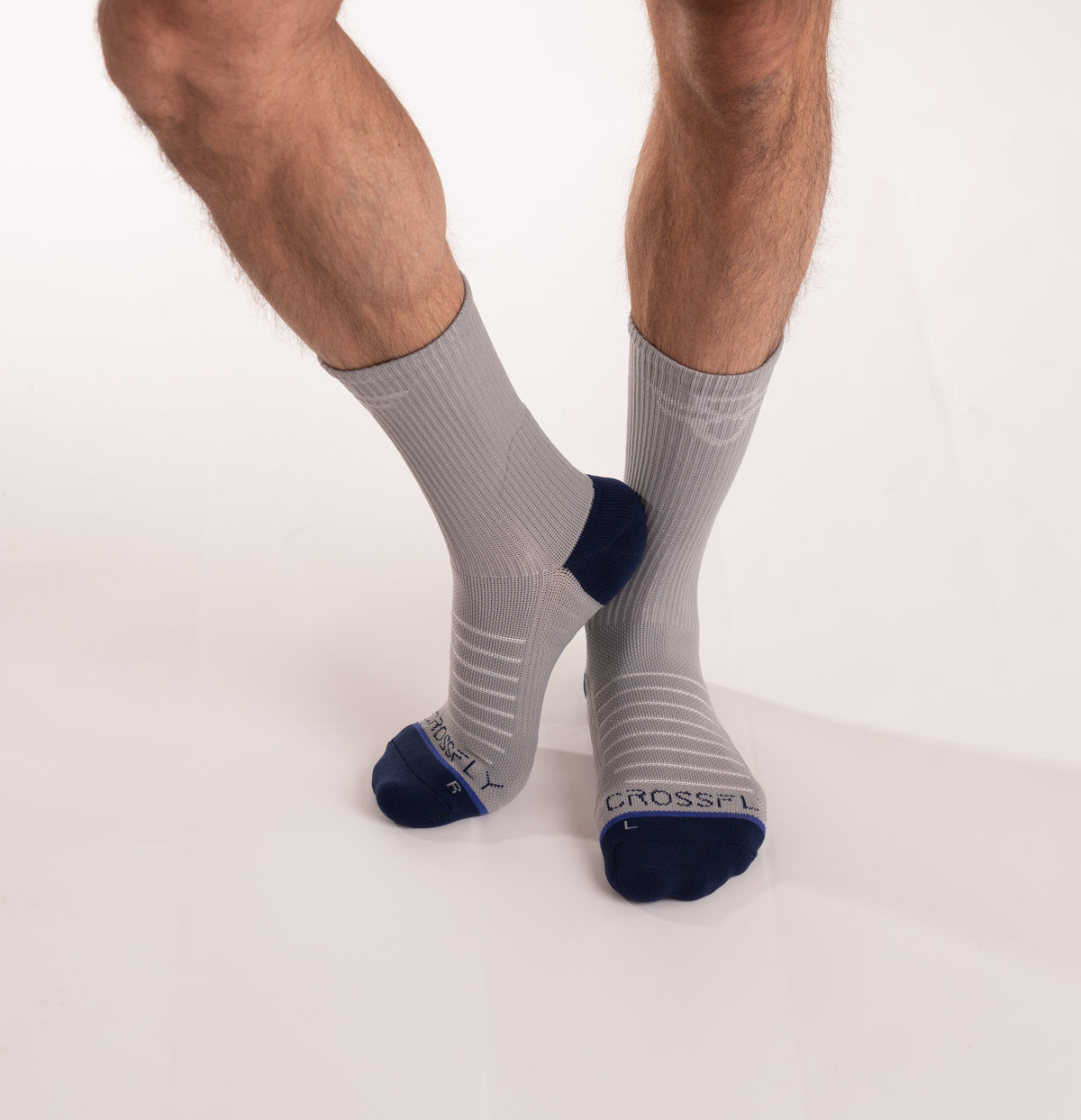 Crossfly men&#39;s Hero Crew Socks in grey from the Performance series, featuring AirBeams and 180 Hold.