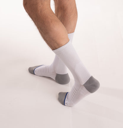 Crossfly men's Hero Crew Socks in white from the Performance series, featuring AirBeams and 180 Hold.
